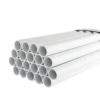 A stack of white PVC pipes arranged in neat rows, showcasing their round openings and smooth surfaces. Its Called Conduit Pipe 20mm x 4m Econo