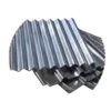 Stack of corrugated sheet 0.3mm with a shiny surface, arranged in a slightly overlapping manner. The wavy pattern is visible, indicating typical roofing material.