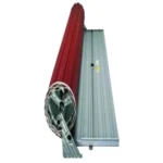 A roll of red roofing sheets is partially unrolled next to a stack of gray, corrugated metal sheets. The materials are positioned against a white background. Its Called Wooden Grain Garage Door