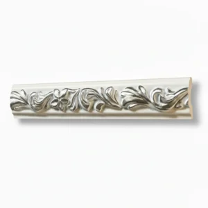 Ornate decorative molding featuring intricate floral patterns in gold and silver tones, displayed in a curved and straight section. Its White and Silver PU Cornice Dado Rail