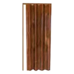 A concertina copper door panel with a shiny, reflective surface. The door is folded, displaying its accordion-like design with vertical ridges. The copper color gives it a warm, metallic appearance. PVC Folding Door with Gunstock Oak Finish