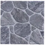 A textured surface featuring irregularly shaped gray stones arranged together, resembling a natural stone wall pattern. The stones vary in size and are outlined with thin, lighter gray mortar. Its called Paving Ceramic Matt Floor Tiles