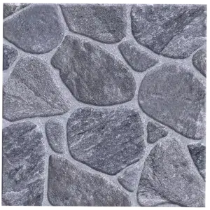 A textured surface featuring irregularly shaped gray stones arranged together, resembling a natural stone wall pattern. The stones vary in size and are outlined with thin, lighter gray mortar. Its called Paving Ceramic Matt Floor Tiles