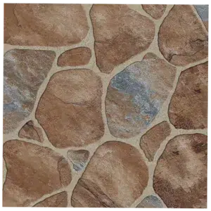 Close-up of textured stone wallpaper featuring irregularly shaped brown and gray stones arranged with light grout lines. Paving Ceramic Matt Slip Resistant Tiles